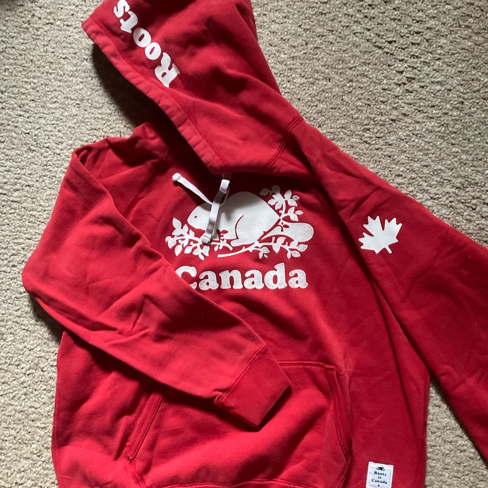 Roots 

Red Hoodie with Canada Design to snuggle up in winter with…